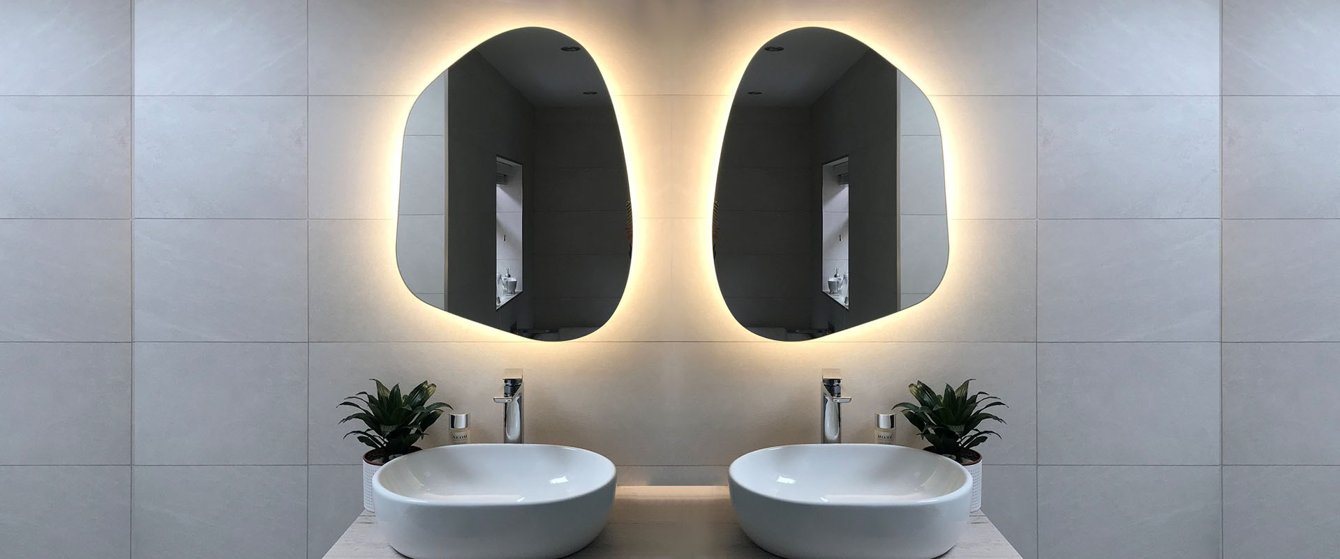Asymmetrical Pebble Mirrors with Shaver Socket